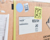 Side panel of LG Chem RESU10H shipping box showing RESU10H JH3 C label, QA Accept stamp, XPO logistics stickers, and UN3480 Lithium Ion Batteries hazmat diamond