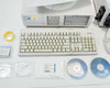 HP Vectra XM 5/120 PC, Compaq keyboard, Labsphere CDs and calibration standards, mouse, and accessories laid out on table
