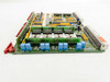 Netstal 110.240.9216A DIO board – low-angle view of bottom edge showing blue terminal blocks labeled C40–C45 and right-angle edge connector