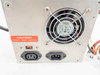 DTK PTP-2001 power supply rear panel showing IEC C14 input connectors, voltage selector switch, and 80mm cooling fan with caution label