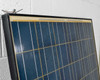 Close-up of upper edge of Yingli YL240P-29b solar panel showing aluminum frame corner and top row of polycrystalline cells