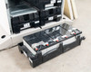 Best Power Axxium Pro battery module removed and sitting on floor, showing three sealed lead-acid cells with red and black terminal connections