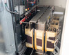 PDI Power Pak M-4 — additional transformer section showing stacked three-phase transformer cores, bus bars, and branch wiring inside lower cabinet