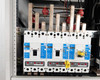 Interior view of transfer switch showing four Cutler-Hammer HKD 65k breakers mounted on bus bars with red bus insulators