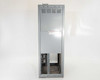 GE Spectra Series Switchboard – rear three-quarter view showing ventilation louvers and lower open access section with sticker labels visible