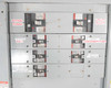 GE Spectra Series Switchboard interior breaker section showing circuit breaker positions labeled Bypass Power, Utility Power, A/C 1, Condenser Pump, Liebert #4, and PDU #2