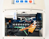 Lenze AC Tech ESV552N04TMC interior view — lower access panel open revealing control terminal strip, power wiring connections, EPM module, and PL3 label on circuit board