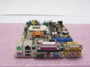 PC Chips 528mE11 GFXcel Socket 370 motherboard — angled front view showing I/O panel with PS/2, USB, LAN, parallel, serial, and VGA ports
