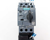 Siemens 3RV2011-1EA15 SIRIUS motor protection circuit breaker — front face showing CLASS 10 marking, 52A, rotary ON/OFF handle, and model label
