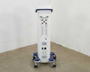 Pollogen Legend+ rear view – full rear of unit showing applicator port panel at top, speaker grilles, power switch, and wheeled cart base