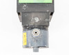 Grundfos Alldos DDA 12-10 dosing pump – top-down view of pump head and liquid end showing PVC body with white calcium/chemical deposits and caution label