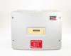 SMA Sunny Boy SB 3800-US-10 solar inverter — slightly angled front view showing enclosure door, LCD display, and SolarCity hazard label