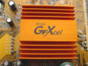 PC Chips 528VE10 motherboard GFXcel heatsink closeup — orange aluminum heatsink labeled PC133 GFXcel