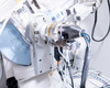 Close-up of X'Pert Pro X-ray tube and detector arm assembly with cabling and tubing visible
