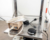Hugle Model 306 ionizer control unit on lower cart shelf with coiled cable, alongside Fuji VG-400C-10W foot pedal