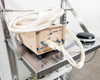 Close-up of Hugle Model 306 ionizer — beige enclosure with Power, High Voltage, and Air controls, Hugle logo visible