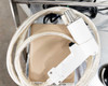 Lower cart shelf showing gas flushing nozzle/wand with Fuji Impulse label and coiled tubing
