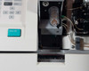 Nova Biomedical BioProfile 100 Plus – close-up of sample compartment with cylindrical sample cup holder, ANALYZE button, and fluidic lines visible