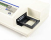 Molecular Devices SpectraMax 250 – microplate drawer open showing black plate carrier and optical reading channel