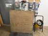 Single 48x48 treated wood pallet showing solid 3/4-inch plywood top surface, front view indoors