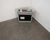 Tour Supply ATA flight case closed, front view showing black laminate exterior, aluminum extrusions, steel ball corners, and tour labels on top