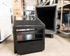 Kent Custom Cases 8U ATA road case partially disassembled in warehouse showing rack core with drawer and detached outer shell