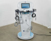 Lumenis NuEra Tight front full-body view with all three handsets and RF heads hanging from cart arms
