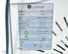 Lumenis NuEra Tight APMD130 specification label showing 470kHz emission frequency, 250W output, 110V AC 60Hz, serial number NUE-18G-0028-1