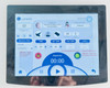 Lumenis NuEra Tight – touchscreen treatment screen in Assisted mode showing Program No. 12, buttocks treatment area, time/set temp controls, and attention alerts