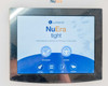 Lumenis NuEra Tight touchscreen startup screen showing NuEra Tight logo with assisted and not-assisted mode icons