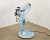 Lumenis NuEra Tight side profile showing console arm folded down, handsets and cables visible
