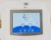 Lumenis NuEra Tight touchscreen display showing NuEra Tight startup screen with not-assisted and assisted treatment mode icons