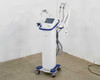 Pollogen Legend+ system three-quarter front view showing applicator arms and tower body