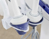 Pollogen Legend+ applicator holders close-up showing two round multi-electrode applicator heads resting in blue-lined cups