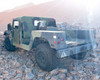 AM General M1152 HMMWV rear view showing cargo bed, tow hooks, and rear panel