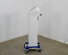 Pollogen Legend+ right side view showing articulating applicator arm bracket mount on white tower