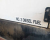 Terex T120 generator enclosure lower panel with No. 2 Diesel Fuel label and diesel staining visible on skid base