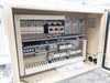 Conveyor control panel interior – full view showing Yaskawa V1000 inverter drives, contactors, terminal blocks, and wiring