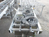 Excel Flow SC23460 conveyor section seen from above with large coils of bundled gray cables resting on roller bed
