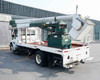 2012 International bucket truck rear three-quarter view – flatbed bed, Hi-Ranger boom turret, and pintle hitch visible