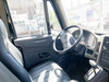Interior cab view of 2014 International 4300 DuraStar – driver seat, steering wheel, automatic gear selector, and dashboard