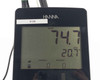 Hanna edge HI2040-01 close-up of LCD showing dissolved oxygen 74.7 percent saturation and ATC temperature 20.7°C with altitude and salinity fields, asset tag E128 visible