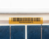 Close-up of gold barcode asset label on panel frame reading PSUP05343060513