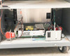 Accutinter 1600HS lower interior – internal power supply board assembly, reset button, and wiring on base shelf