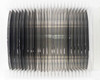 Open cassette showing approximately 25 polished 100mm silicon wafers standing upright in white plastic carrier – angled overhead view
