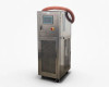 Lneya Sundi-255 recirculation chiller front-left three-quarter view showing stainless steel cabinet, HALIO touchscreen, emergency stop button, and orange silicone hose looped over the top
