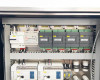 Lneya Sundi-225-2TN chiller – internal control panel view showing circuit breakers, DIN-rail mounted PLCs, I/O modules, and wiring