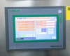 Lneya Sundi-225-2TN lower touchscreen HMI showing active temperature monitoring screen with process values and Start/Stop controls