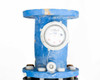 Arad WM80 water meter — front face close-up showing circular analog register dial with Arad branding and mounting bolts