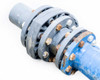 Arad WM80 valve assembly — close-up of multi-flange valve section showing gray flanged discs and corroded hex bolts